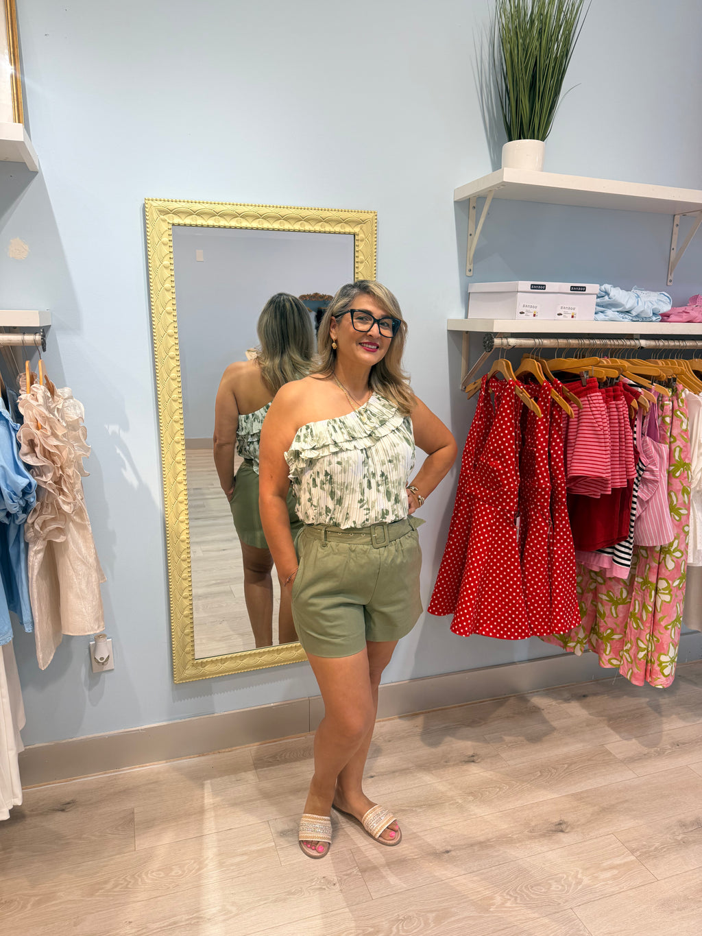 green shorts with matching belt