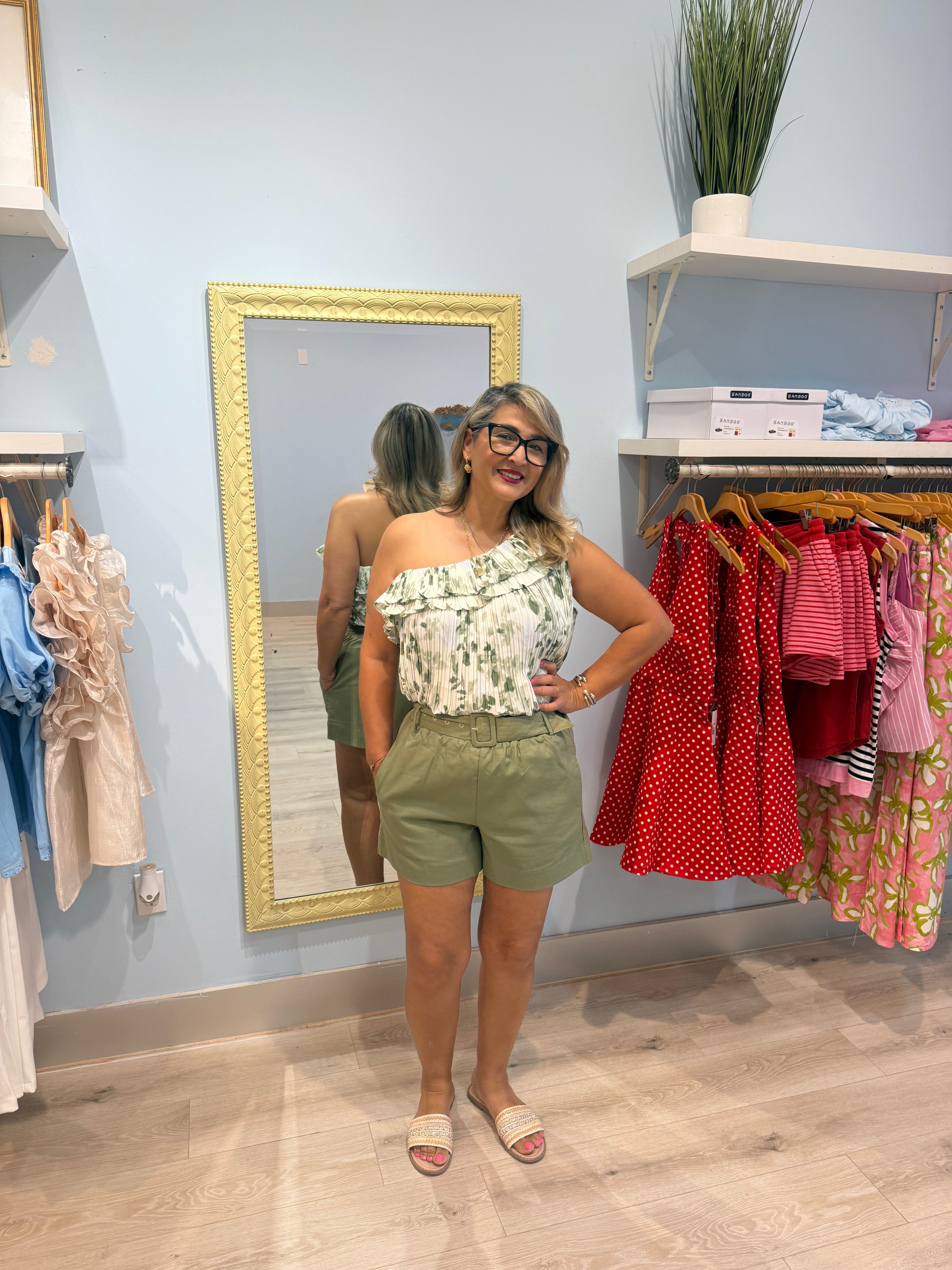 green shorts with matching belt