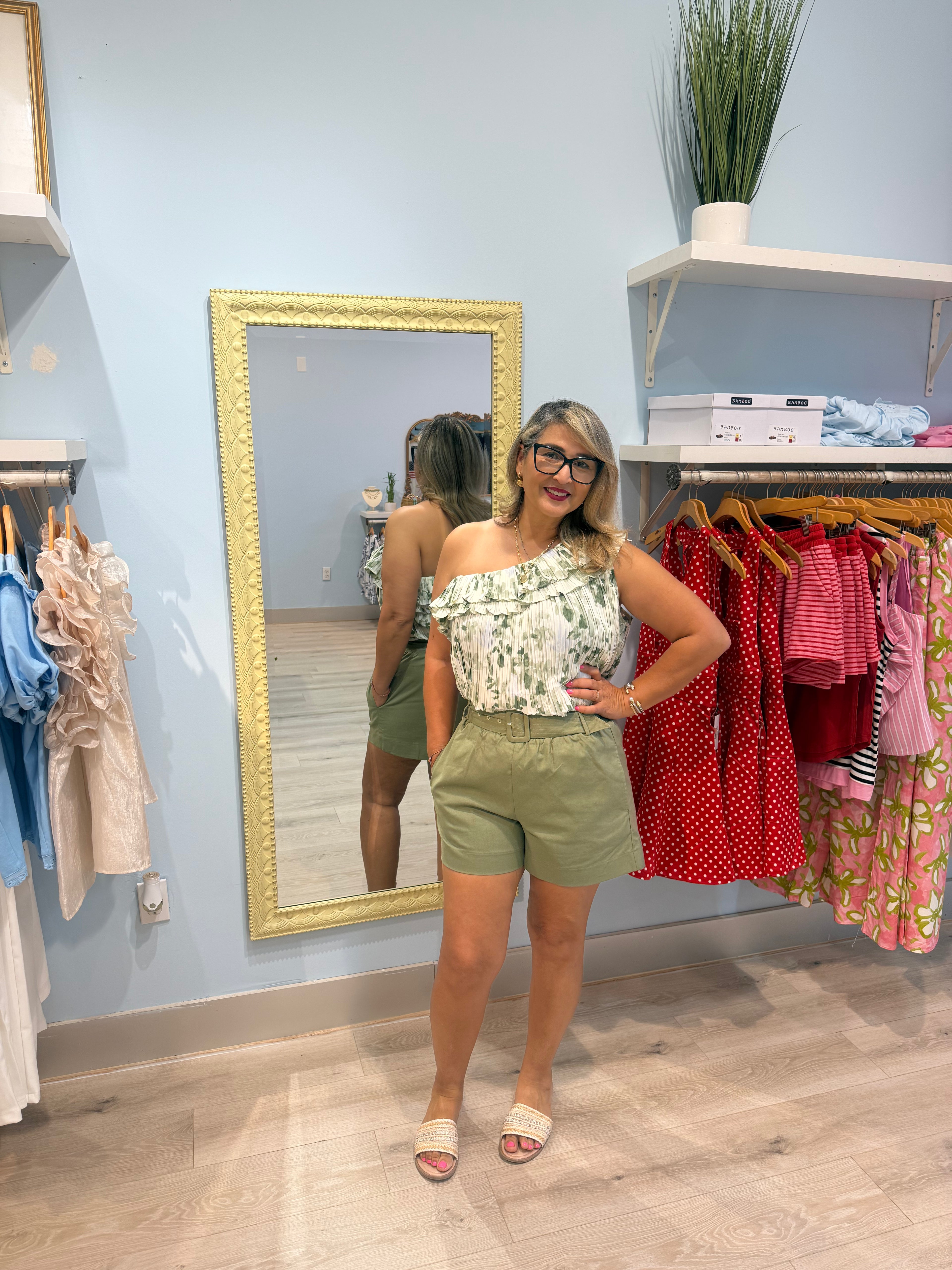 green shorts with matching belt
