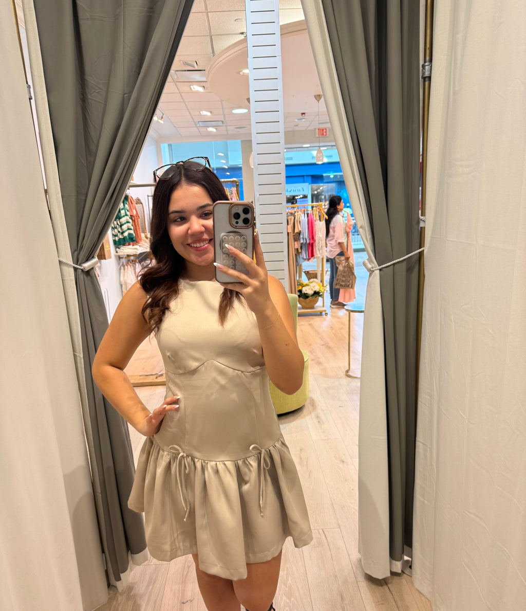 beige mini dress with bows